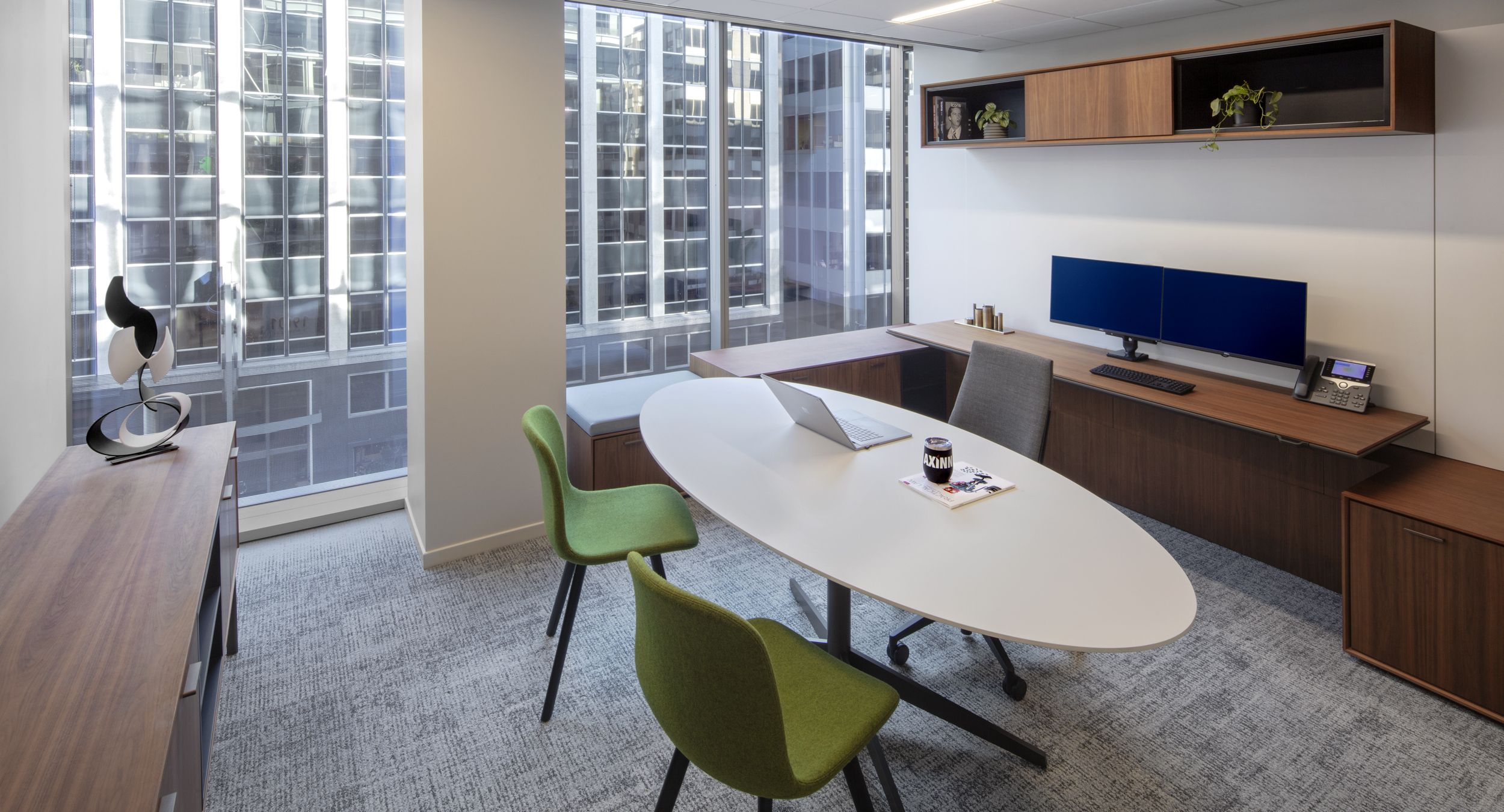 HALO OFFICE suite with matching HALO credenza and Alpine White oval SESSIONS table-desk. 